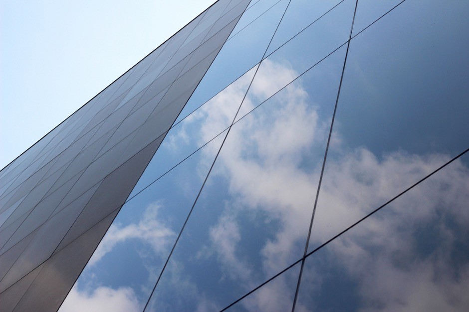 Modern glass building with protective window security film for added glass protection.